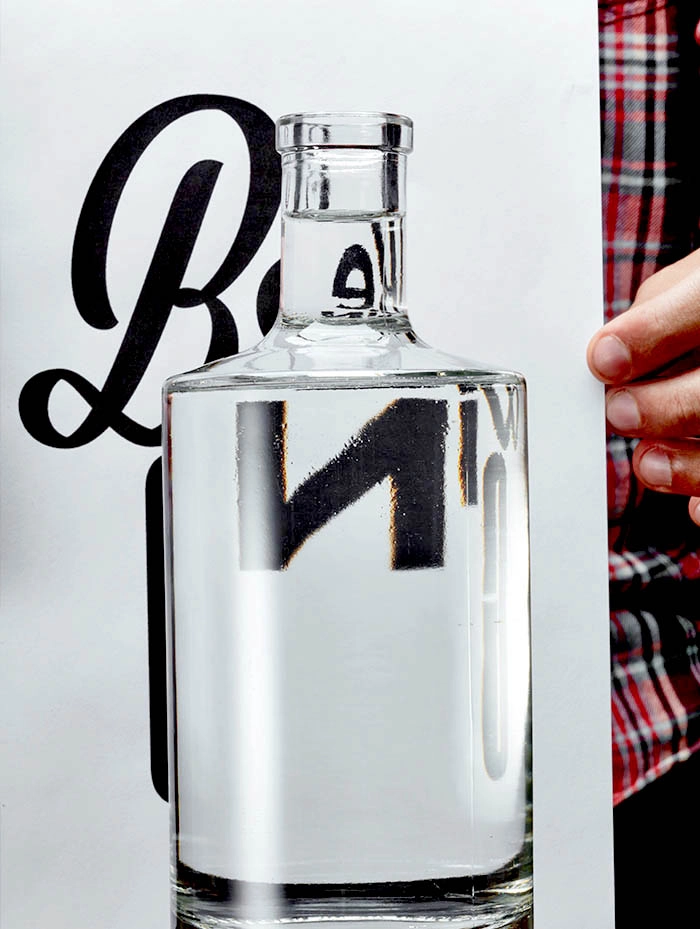 Desgin Bottle poster with refracted typography