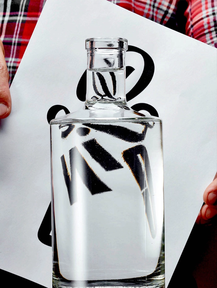 Desgin Bottle poster with refracted typography